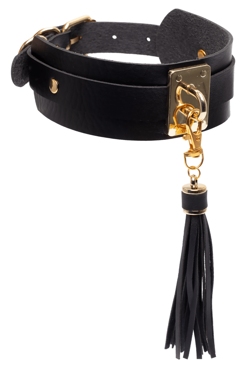 Kaulakoru tupsulla ja kultaisilla yksityiskohdilla