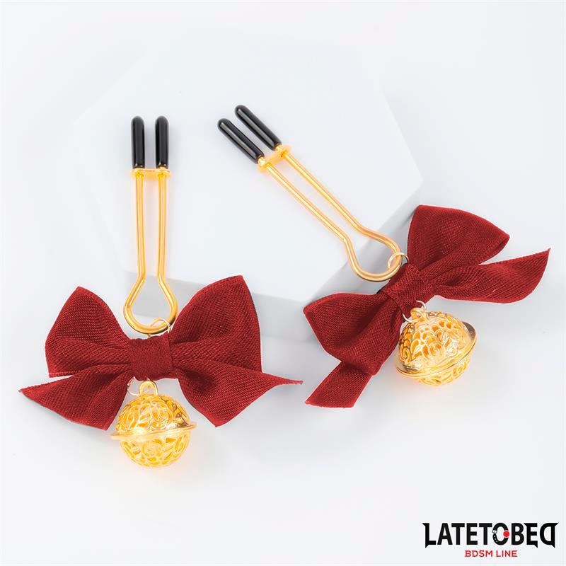 Bröstklämmor med Rosett och Bjällror